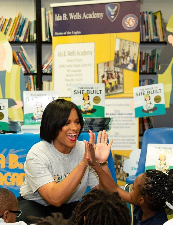 Tammie Ross with children at community event
